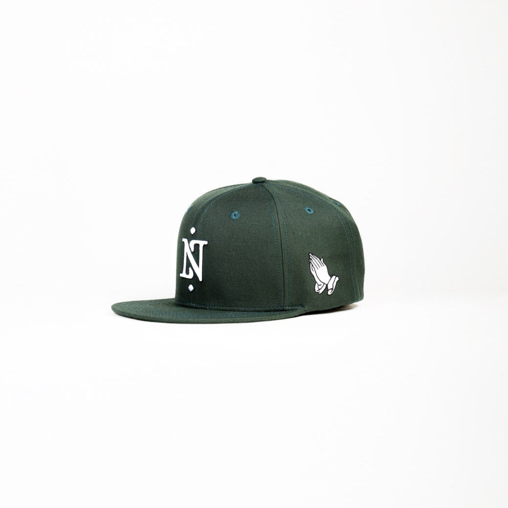Green cap with a logo on a white background